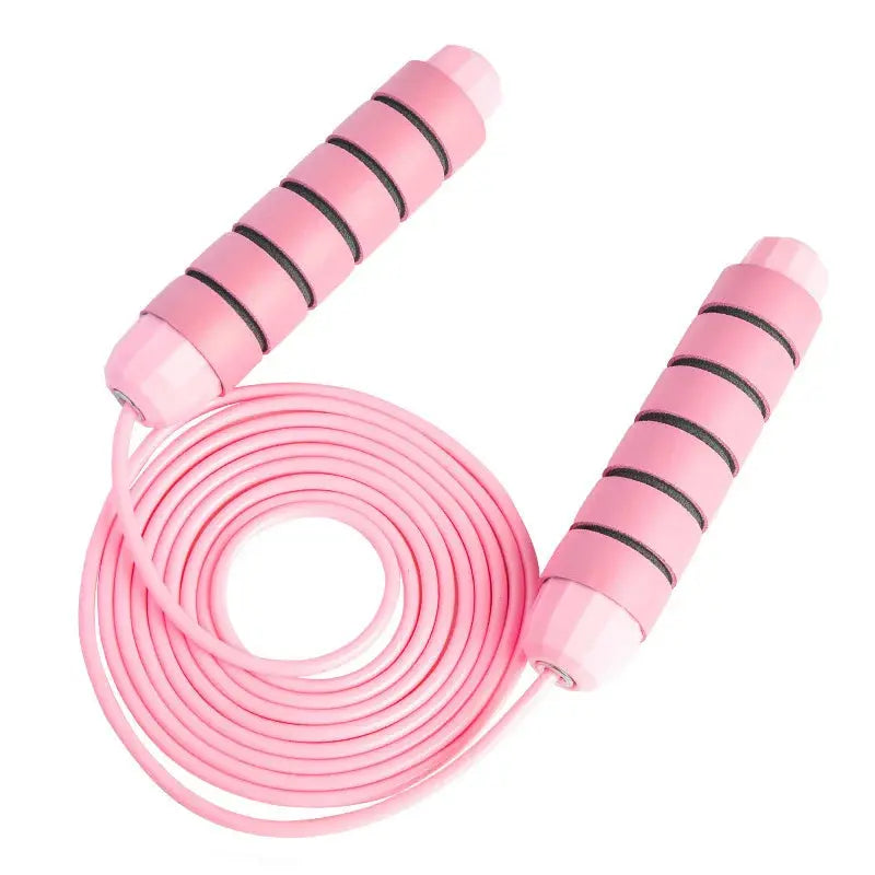 Corde à sauter rose en PVC avec poignées ergonomiques pour fitness, cardio et entraînement à domicile